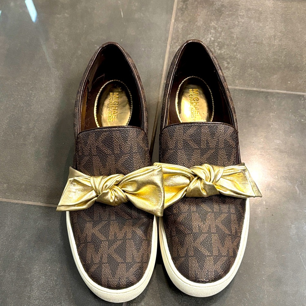 Michael Kors Brown Slip-Ons with Gold Knot
